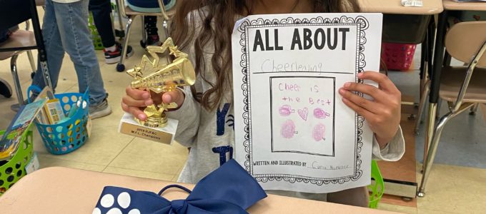Girl 1 with All About Me Book