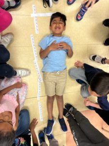 Students measuring 3