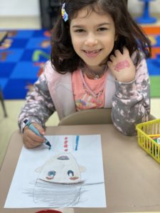 Girl drawing Johnny Appleseed