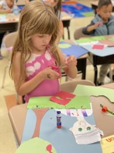 Girl doing apple tree craft