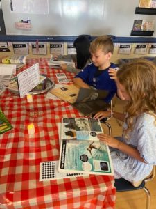 Students looking at books