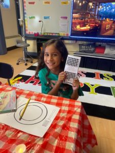 Girl showing her list of books