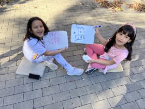 Girls doing math in the garden