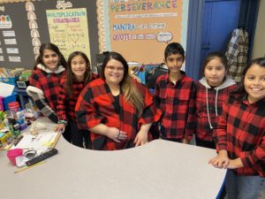 students in buffalo plaid