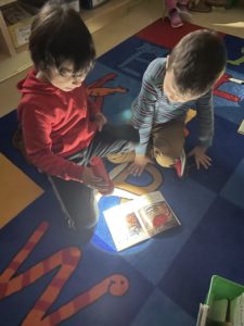 Students reading with flashlights