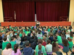 Mr. Bligh reading to students