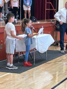 Boy and Girl reciting poem