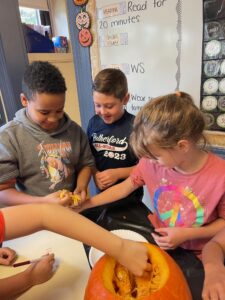 Students counting pumpkin seeds