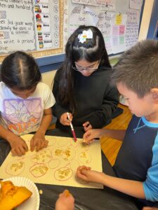 Students counting pumpkin seeds