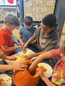 Students counting pumpkin seeds