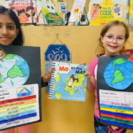 two students showing their maps