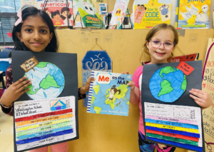 two students showing their maps