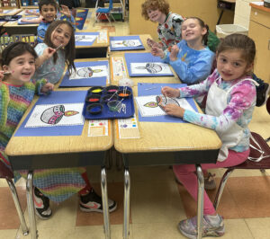 Student Painting Diwal Lamps