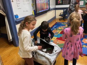 3 Students with Top Soil