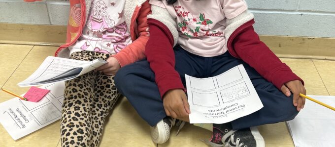 Students with their writing samples