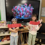 Two students with paper lanterns