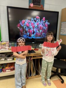 Two students with paper lanterns