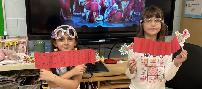 Two students with paper lanterns