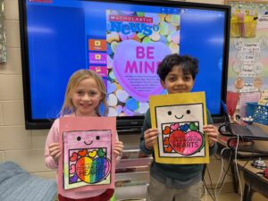 Boy and girl with heart cards
