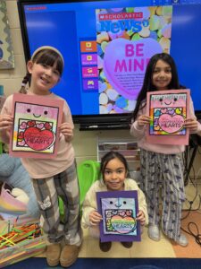 Three girls with heart cards