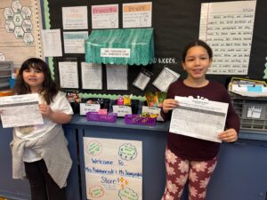 2 girls at class store