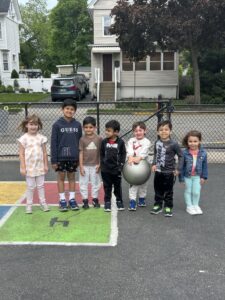 5 boys and 2 girls on the playground