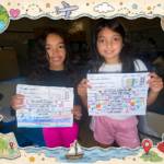 2 girls showing their work
