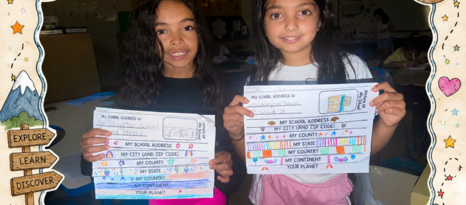 2 girls showing their work