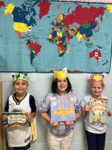 Three students with books