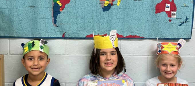 Three students with books