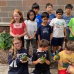 students with pumpkins