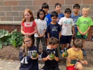 students with pumpkins