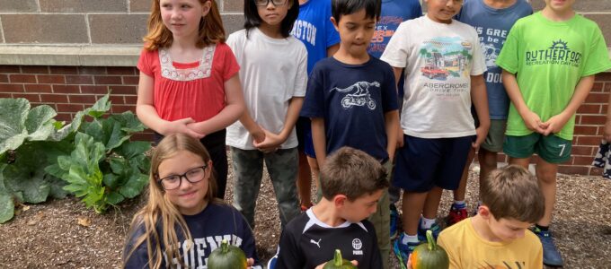students with pumpkins
