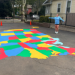 Girl by playground map