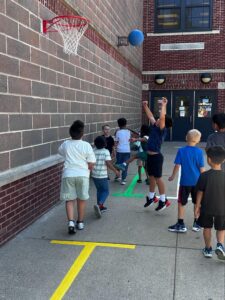 Students playing basketball