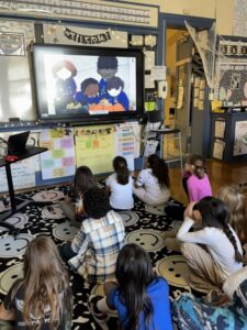 students watching video