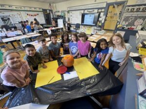 students with pumpkin