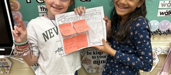 Two girls with book